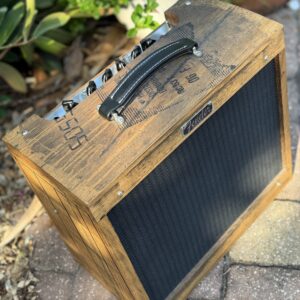 Fender Custom Shop Master Built Amplifier The Distiller 15-Watt Hand-Built, Hand-Detailed from Kentucky Bourbon Barrels, Each One is Unique and Only 25 Made for the US. Based on Blues Junior and using American-made Eminence Cannabis Rex Speaker using White Oak Cabinets for a unique warm tone unique to these amps.